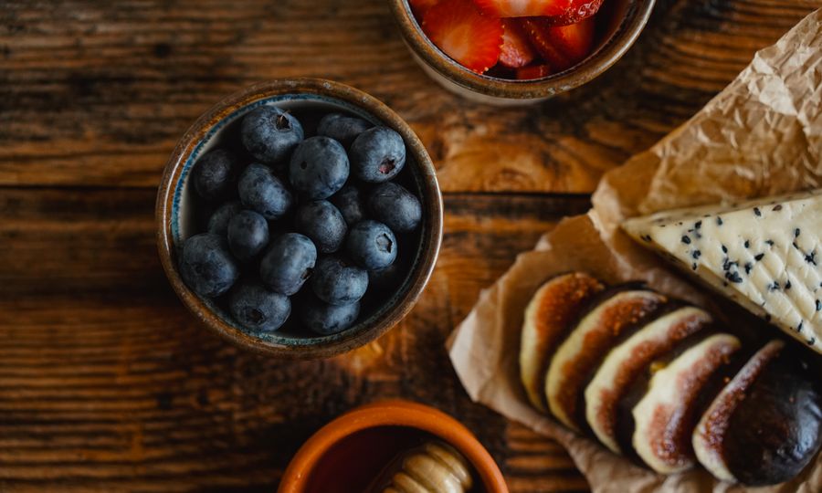 Heart-healthy foods with berries and fresh fruit on a table