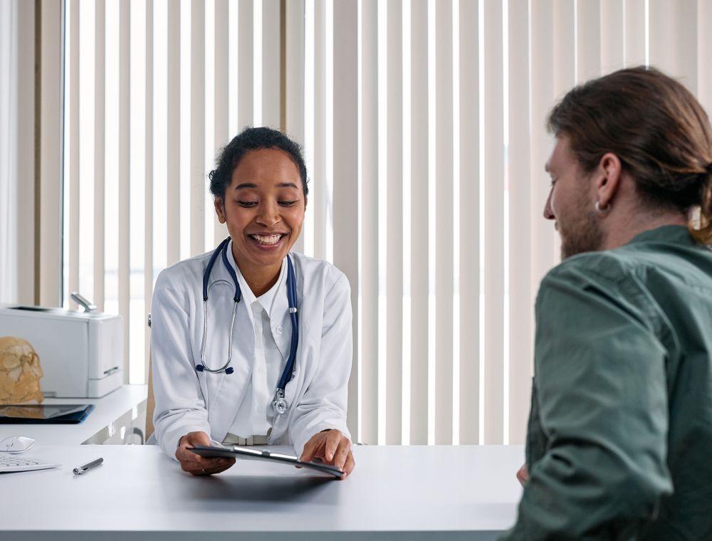 Doctor talking with a patient during an outpatient consultation